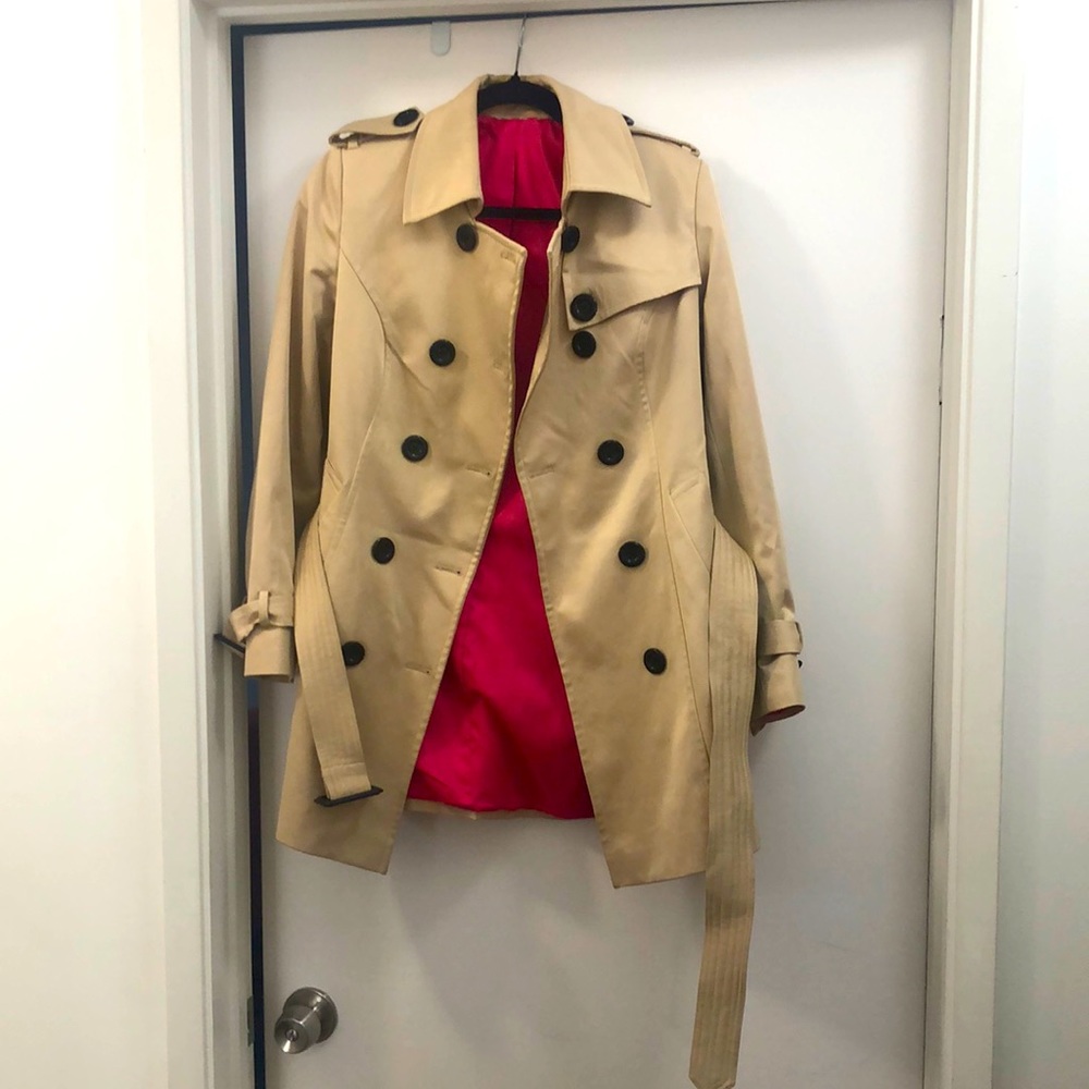 Trench coat fits medium, hits mid-thigh. Barbie pink lined. Inside pocket.